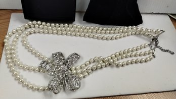 Arnold Scaasi Signed Triple Strand Faux Pearl Necklace With Crystal Bow Enhancer