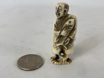 Japanese Carved Netsuke Man With Fish