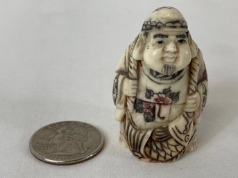 Japanese Carved Bone Netsuke Man With Fish