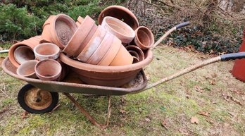 Wheelbarrow And Large Lot Of Clay Pots