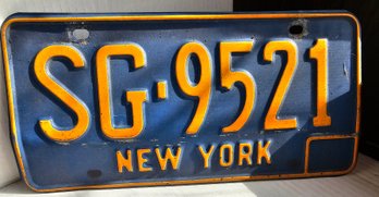 #74 - NY License Plate SG 9521 Has Dent