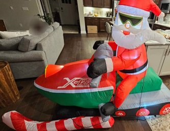 Santa On A Snowmobile Inflatable  7ft X 5ft High