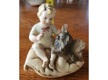 Child With Dog Figurine