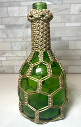 Large Vintage Green Jug/ Bottle With Hand Woven Macrame Cover.