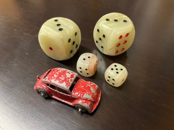 Two Sets Of Carved Stone Dice And Chippy Fun Red Metal Car Toy
