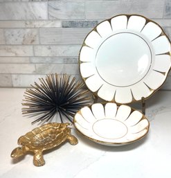 Festive Gold And White Plates, A Gold Leaf Turtle Trinket Dish And A Gold And Black Spiky Sculpture