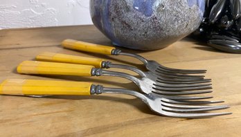 Four Vintage Butterscotch Handled Forks