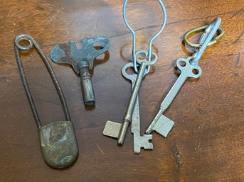 Four Old Keys And A Vintage Pin