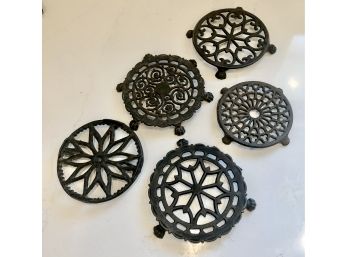 Set Of Five Vintage Cast Iron Trivets.