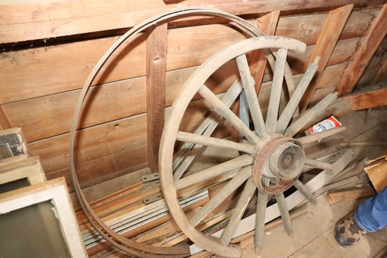 LOT 140 - OLD WAGON WHEEL, 2 LARGE AND 2 SMALL METAL WHEEL BANDS