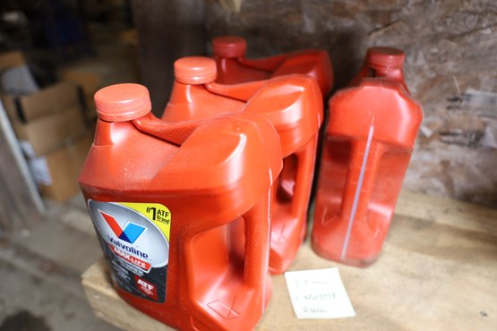 LOT 70 - 3 FULL - ONE MOSTLY - FULL SYNTHETIC TRANSMISSION FLUID GALLONS