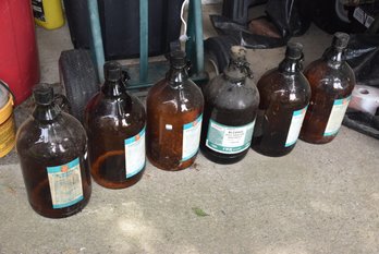 LOT 89 - BROWN GLASS JUGS