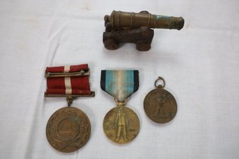 LOT 82 - AWARDS AND SMALL CANNON
