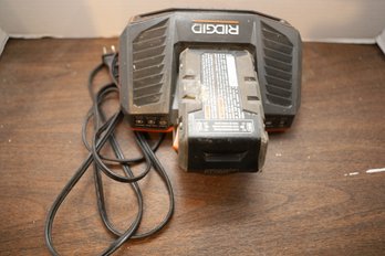 LOT 215 - RIDGID BATTERY AND CHARGER