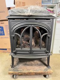 158 - JOTUL PROPANE STOVE, CAN BE CONVERTED TO NAT. GAS, ON ROLLER FOR SUPER EASY REMOVAL!