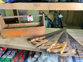 202 - VINTAGE SAWS AND WOODEN TOOL CARRIER