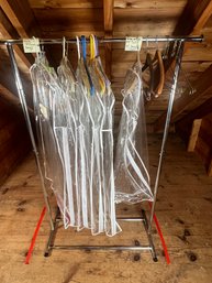 371 - COTHING RACK AND BAGS AND HANGERS