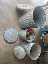 401 - GALVANIZED TRASH CANS WITH BIRD FOOD
