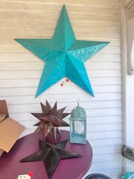 20 - METAL STARS AND CANDLE HOLDERS - FOUR ITEMS