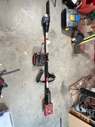 93 - DR POLE SAW, WITH BATTERY CHARGER