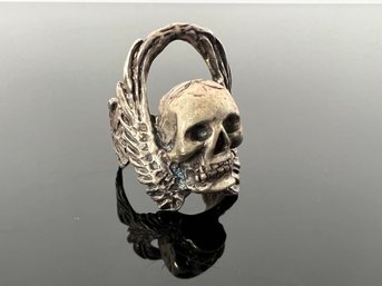 LOT 104 - HUGE STERLING FLYING SKULL RING - COOL!