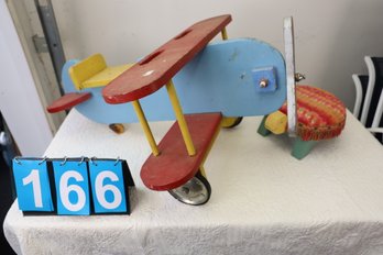 LOT 166 - WOODEN RIDE ON VINTAGE PLANE AND TURTLE STOOL