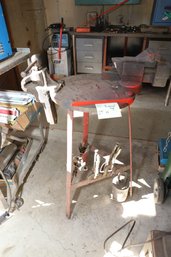 LOT 342 - HEAVY METAL FABRICATED STAND WITH TWO ATTACHED AND VISES AND ITEMS ON IT