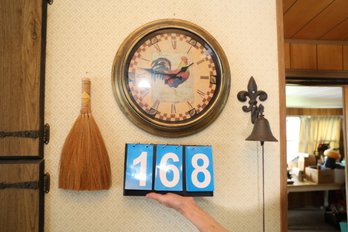 168 - CLOCK AND ITEMS ON WALL