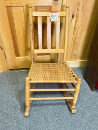 259 - WOODEN AND WICKER ROCKING CHAIR