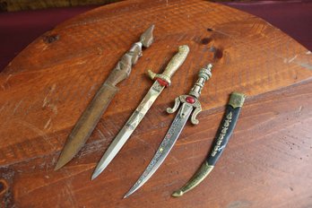 Three Decorative Knives, One With Sheath, One Wooden Carved
