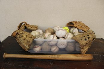 4 Gloves, 1 Bat And A Bucket Of Softballs And Baseballs