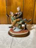Antique  Capodimonte Porcelain Figurine On Wood Base Of Man Sitting On Guys Lap