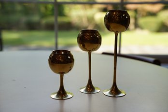 Set Of Three Brass Candle Holders In Goblet Form