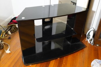 Modern Style Black Colored Tv Stand With Glass Shelf