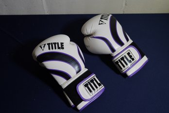 Pair Of Purple And Black Infused Foam Title Boxing Gloves