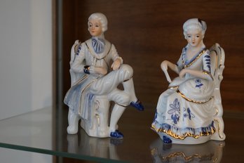 Blue & White With Gold Detail Seated Figurines Depicting A 17th Or 18th Century Lady & Gentleman