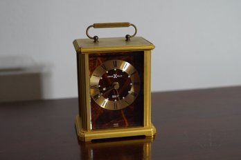 Diminutive Howard Miller Quartz Battery Operated Brass Tone Table Clock