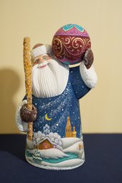 G. DeBrekht Woodcarver Hand Painted Santa Figurine Holding A Ball  Signed And Limited Edition 9/175