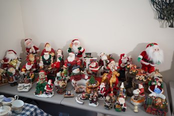 Large Collection Of Christmas Decor Featuring A Variety Of Santas