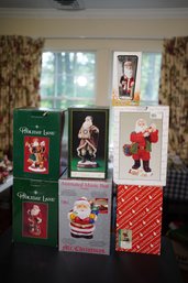 7 Santa Figurines With Boxes