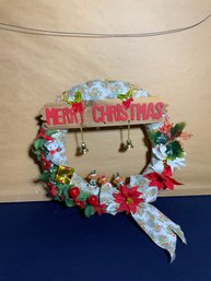 Festive Merry Christmas Wreath Decorated With Faux Poinsettias