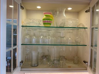 Three Shelves Of Glassware - Includes Stemware, Bowls, MCM Glasses, & A Pink, Green & Yellow Vase K2