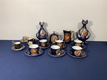 16 Pcs. Of Lovely Blue & Gold Tableware With Figural Motifs, Includes Tea Cups & Saucers & Two Urns