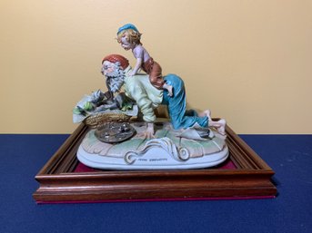 Vintage Capodimonte Porcelain Figurine On Wooden Base Of Whimsical Scene With An Elderly Man & Child