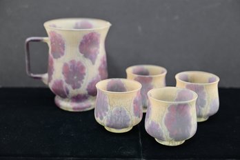 Elegant Art Glass Pitcher With Four Cups Featuring A Purple Abstract Floral Design