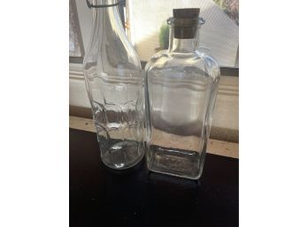 LOT OF 2 GLASS BOTTLES