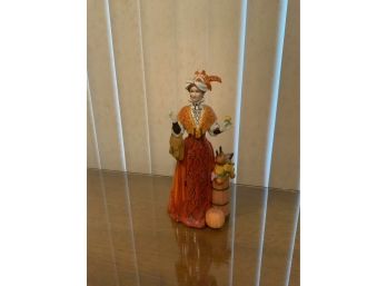 PORCELAIN 1991 ALBEE AWARD FIGURINE ORANGE DRESS (9.5 INCHES HEIGHT)