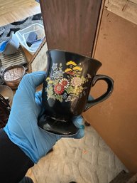 Footed Mug With Black And Gold Floral Accents