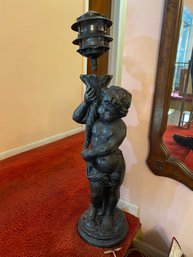 Bronze Colored Statue Of Cupid Holding Lamp