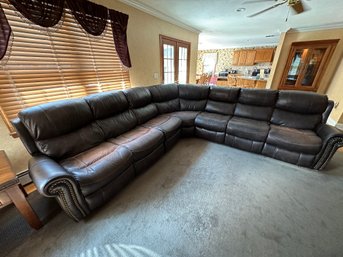 7 Piece Leather Sectional With 3 Motorized Recliners.